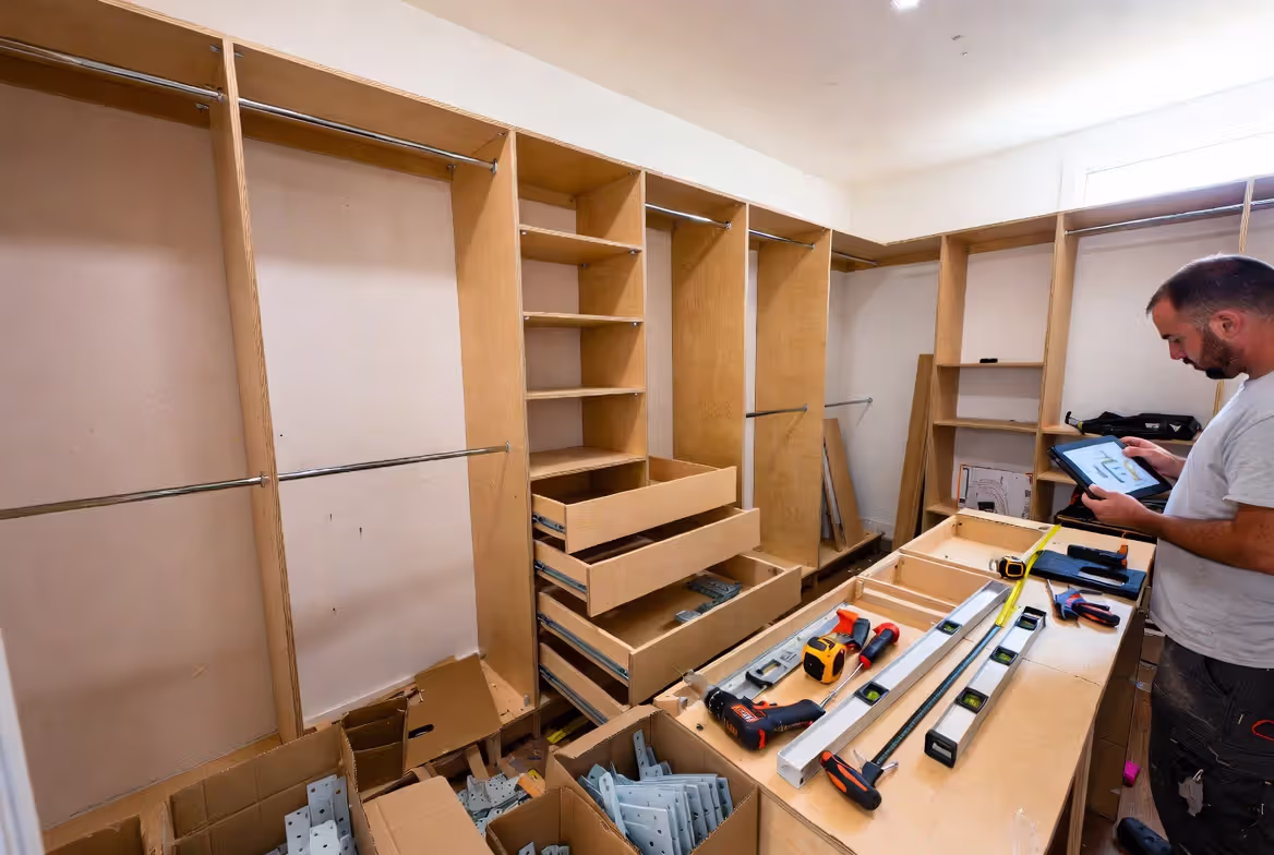 Contractor installing a custom closet organization system